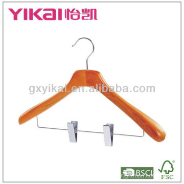 wooden coat hanger with wide shoulders and metal clips